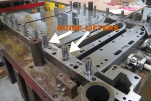 Die lifters on a production tooling die